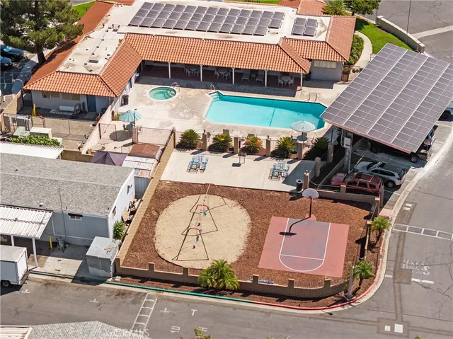 an aerial view of a house with a swimming pool