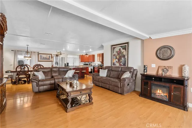 a living room with furniture and a wall painting