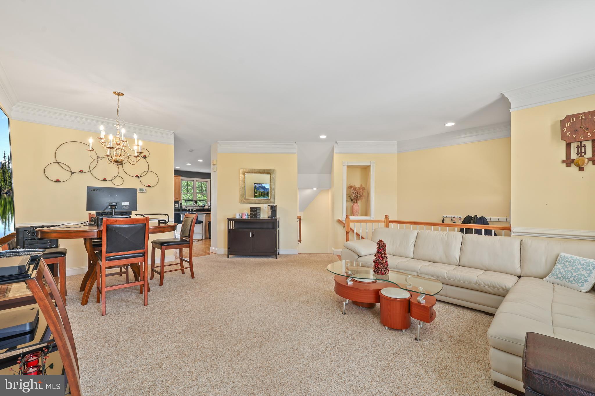 6806 Witton Circle Gainesville, VA 20155 - Photo 5 of 47 a living room with furniture and a chandelier