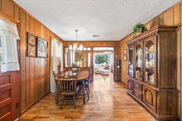 a view of a chairs and table in a balcony