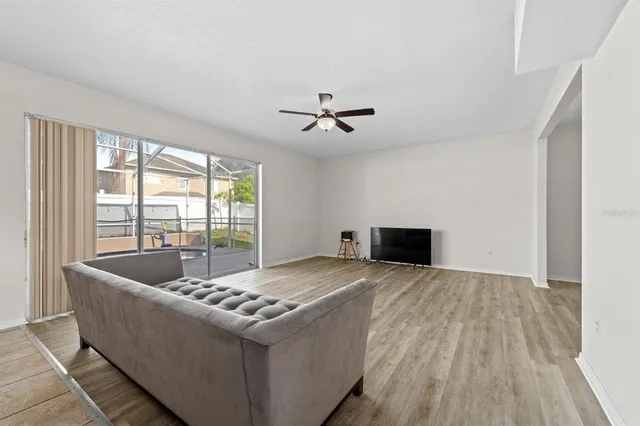 a living room with couch and a fireplace