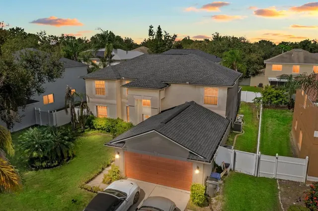 a view of backyard with plants and outdoor seating