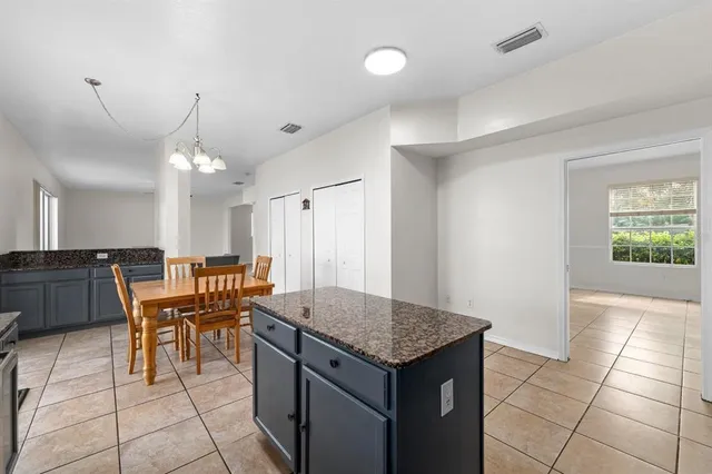 a view of a kitchen and dining area