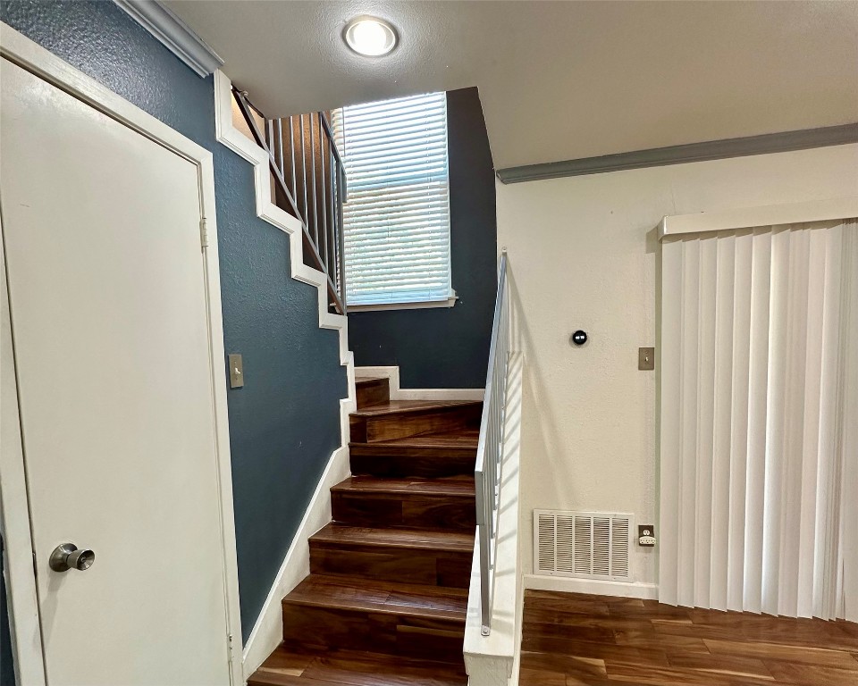 2018 West Rundberg Lane, Unit 5B Austin, TX 78758 - Photo 12 of 23 a view of entryway with wooden floor and stairs