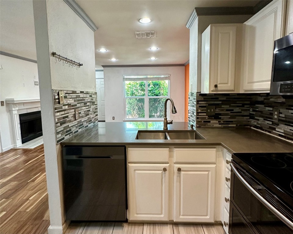 2018 West Rundberg Lane, Unit 5B Austin, TX 78758 - Photo 10 of 23 a kitchen with granite countertop a sink and a stove