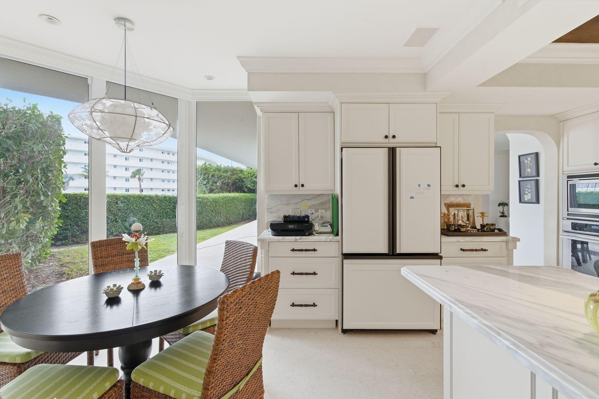 2500 South Ocean Boulevard, Unit 1A1 Palm Beach, FL 33480 - Photo 14 of 34 a very nice looking dining room with a table and chairs