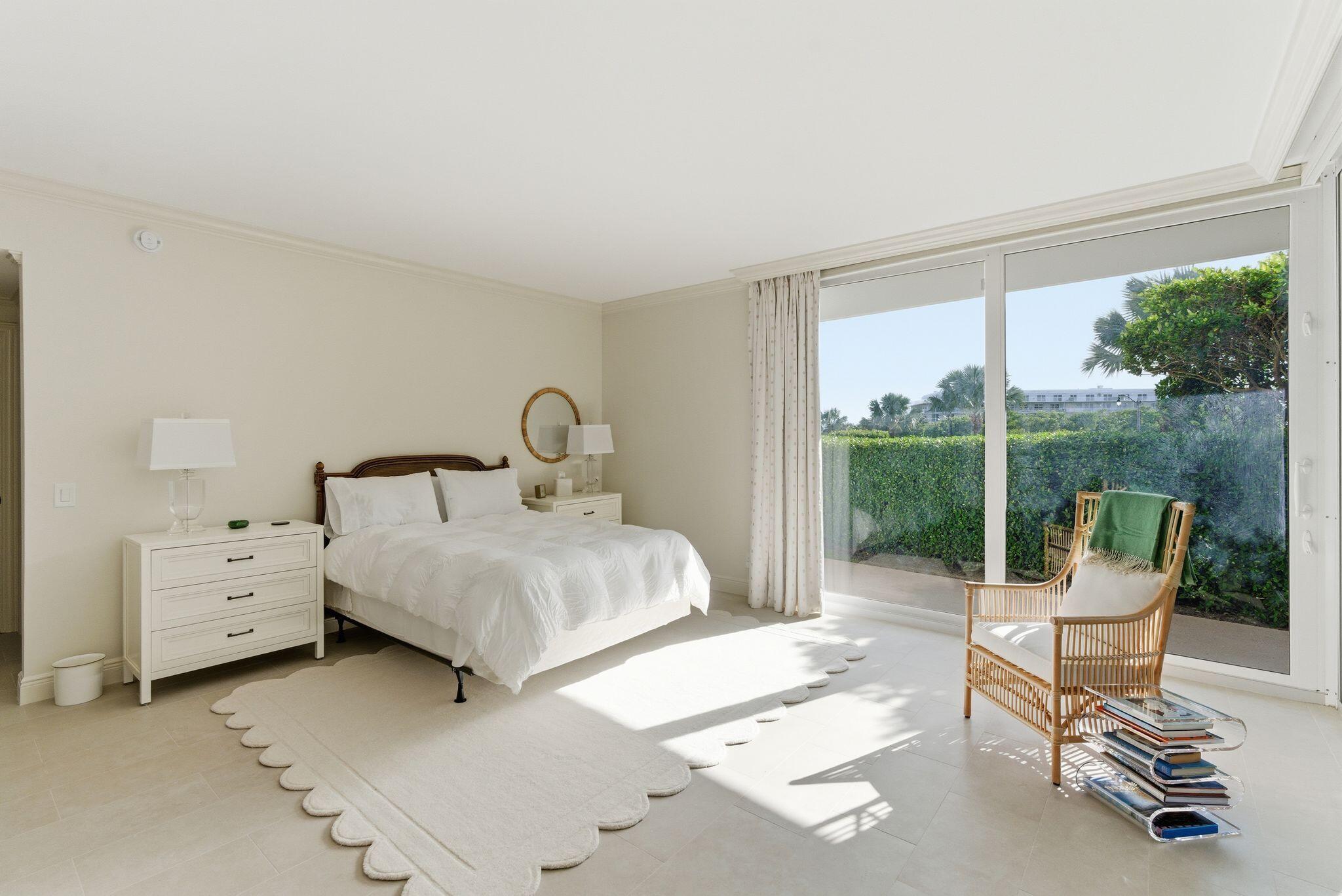 2500 South Ocean Boulevard, Unit 1A1 Palm Beach, FL 33480 - Photo 21 of 34 a bedroom with a bed and large window