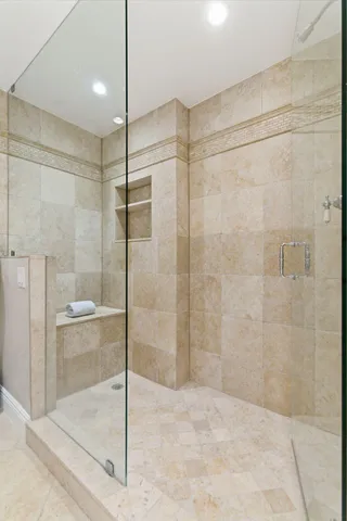 a bathroom with a shower and a sink