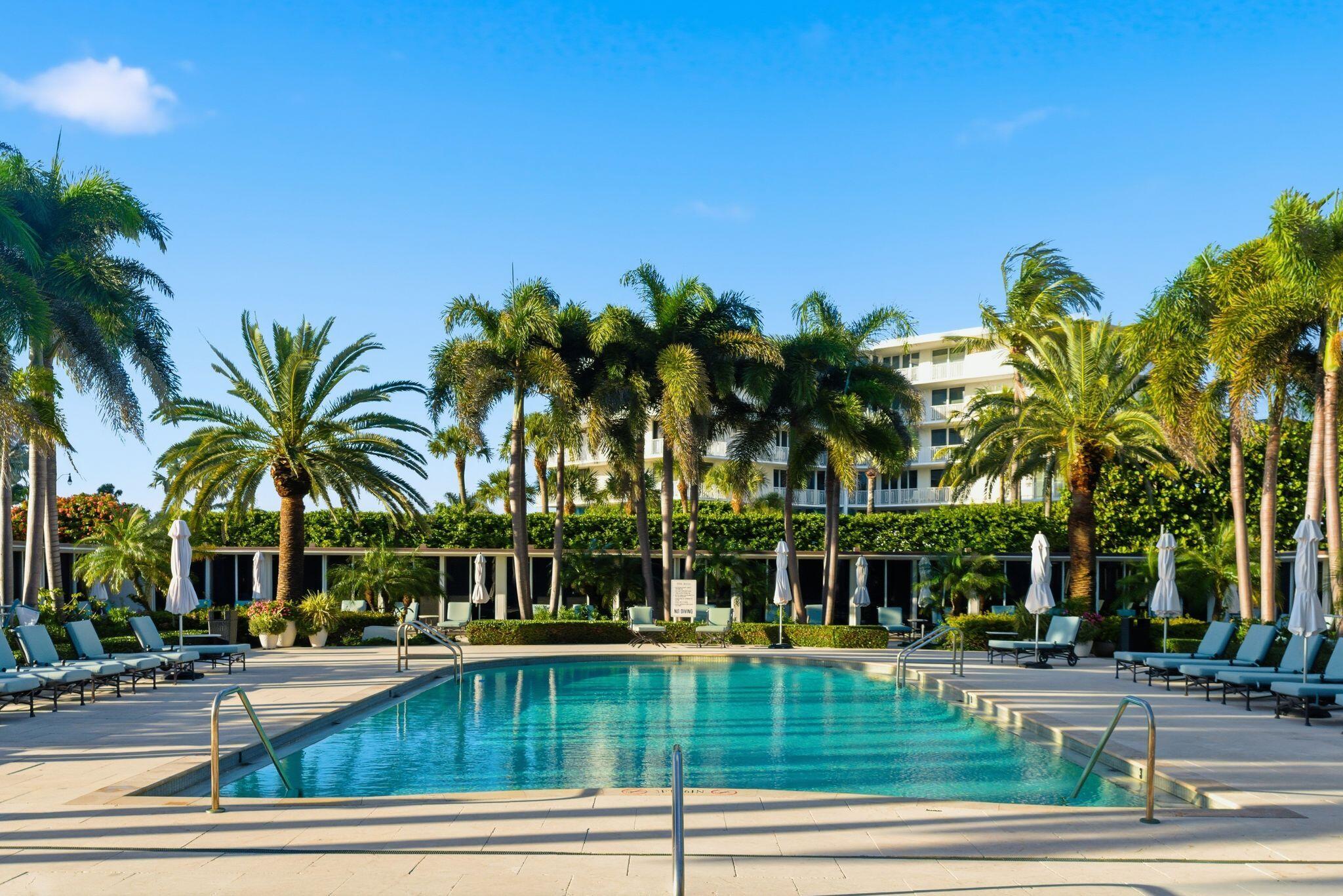 2500 South Ocean Boulevard, Unit 1A1 Palm Beach, FL 33480 - Photo 29 of 34 a view of a swimming pool with palm trees