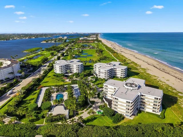 an aerial view of ocean with residential house