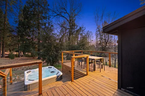 a balcony with furniture and wooden floor