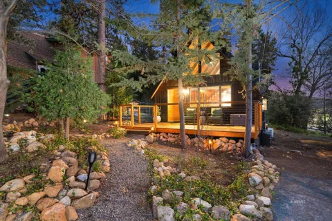 a backyard of a house with outdoor seating
