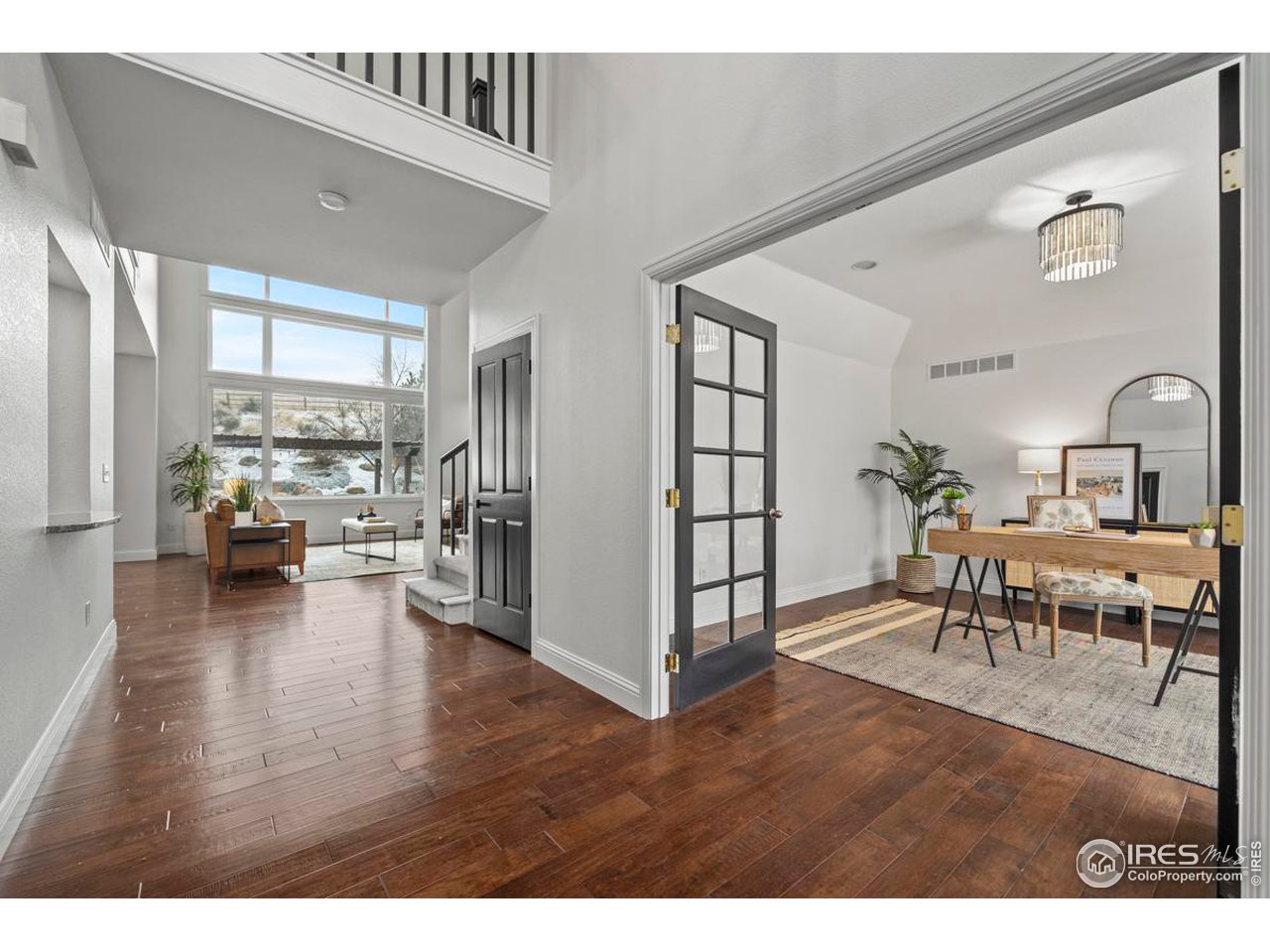 2097 Meander Road Windsor, CO 80550 - Photo 11 of 33 a living room with furniture and a table