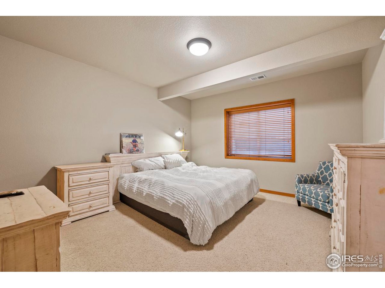 2097 Meander Road Windsor, CO 80550 - Photo 22 of 33 a bedroom with a bed and a window