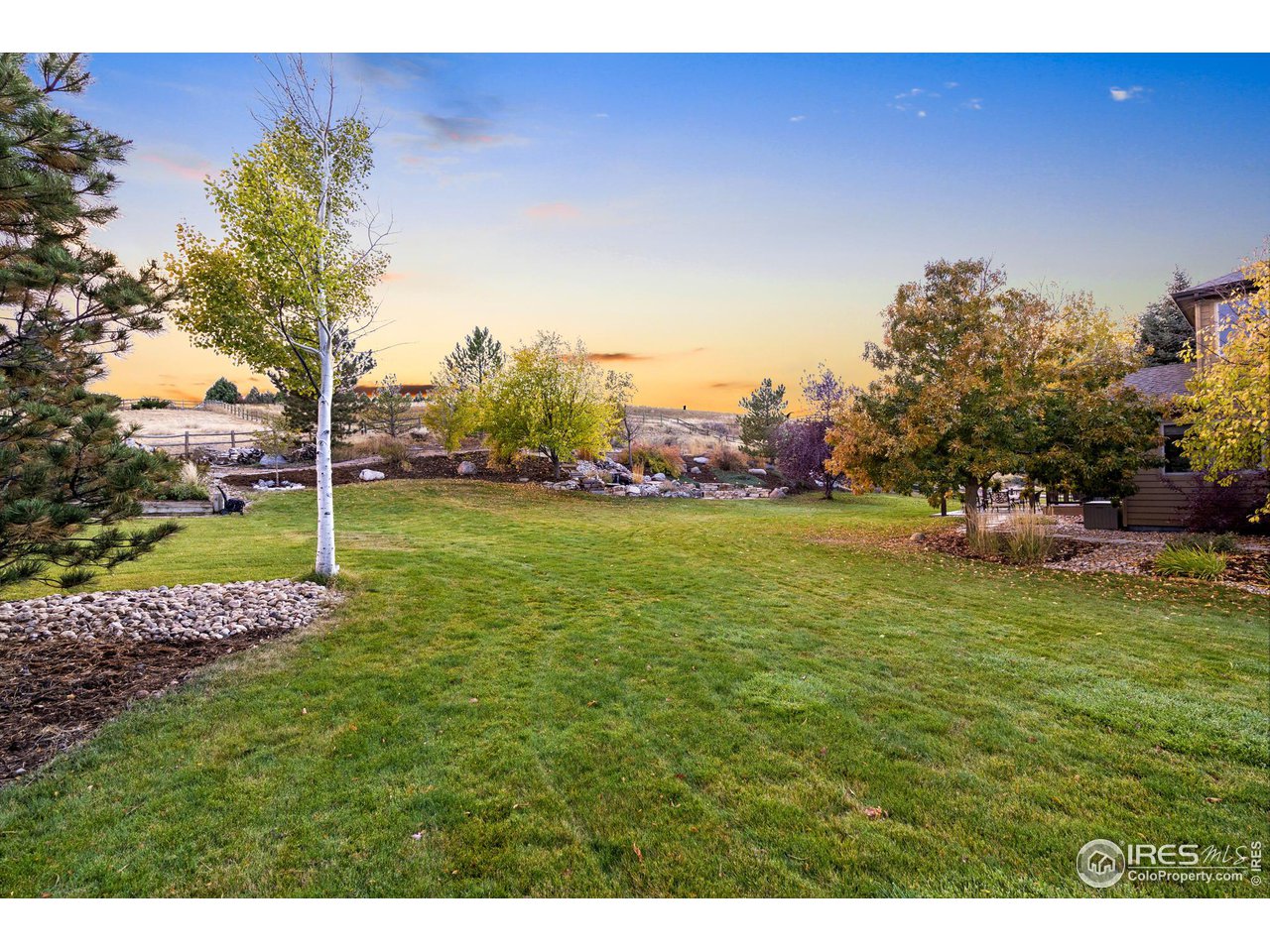 2097 Meander Road Windsor, CO 80550 - Photo 29 of 33 a view of a field of grass and trees