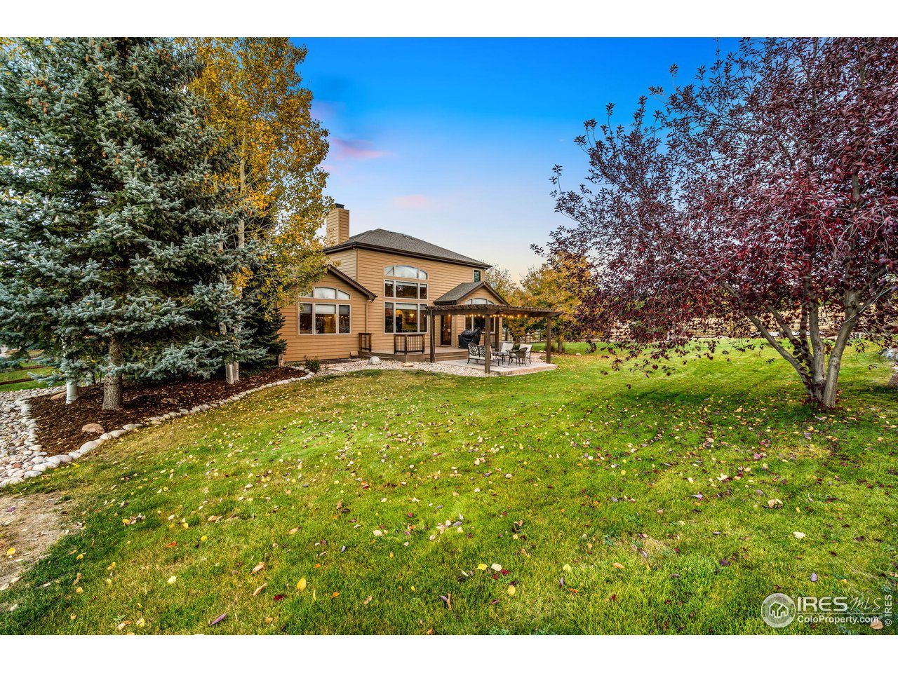 2097 Meander Road Windsor, CO 80550 - Photo 30 of 33 a view of a house with a big yard