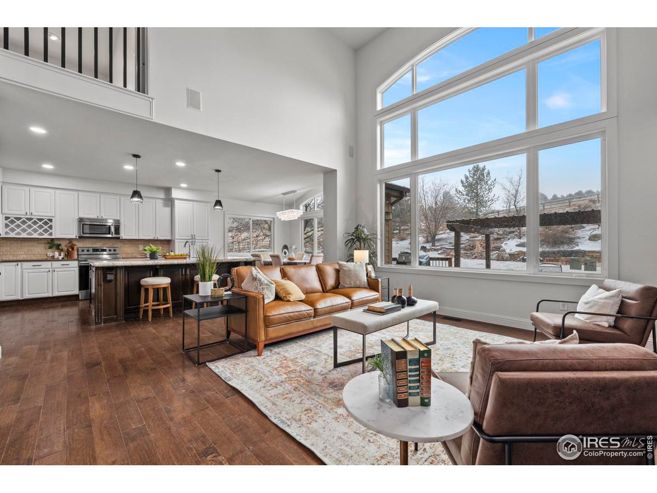 2097 Meander Road Windsor, CO 80550 - Photo 4 of 33 a living room with furniture and a table
