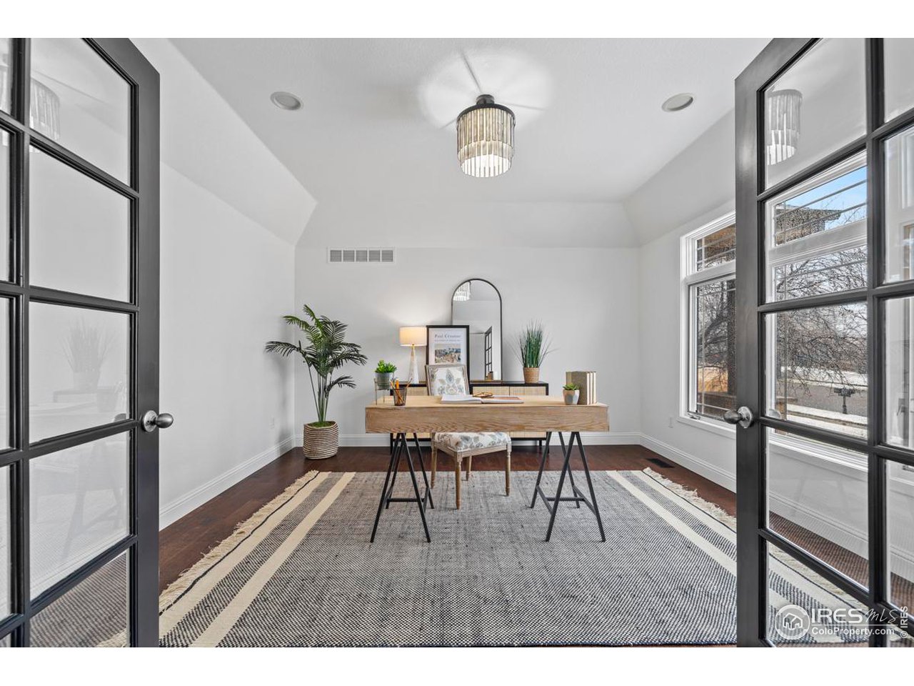 2097 Meander Road Windsor, CO 80550 - Photo 10 of 33 a view of a dining room with furniture window and wooden floor