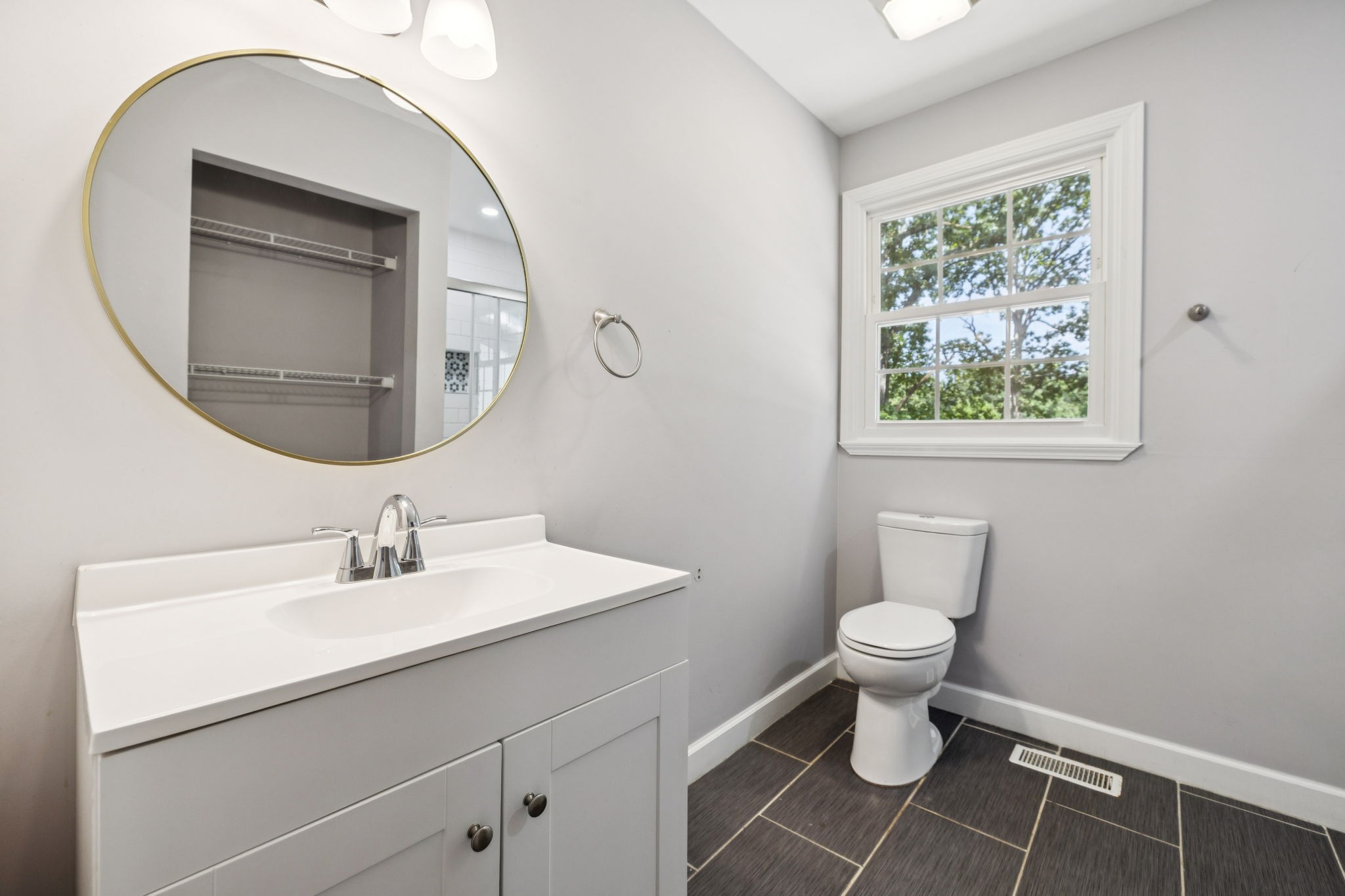 102 Warren Place Dickson, TN 37055 - Photo 21 of 52 a bathroom with a toilet sink and mirror