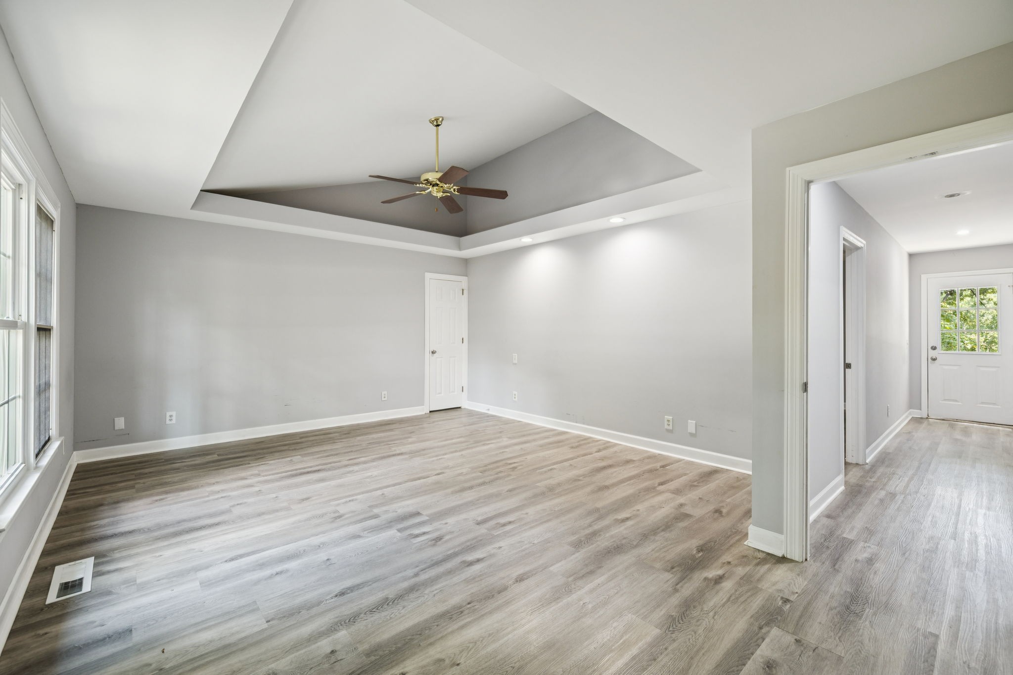 102 Warren Place Dickson, TN 37055 - Photo 24 of 52 a view of an empty room with wooden floor and a window