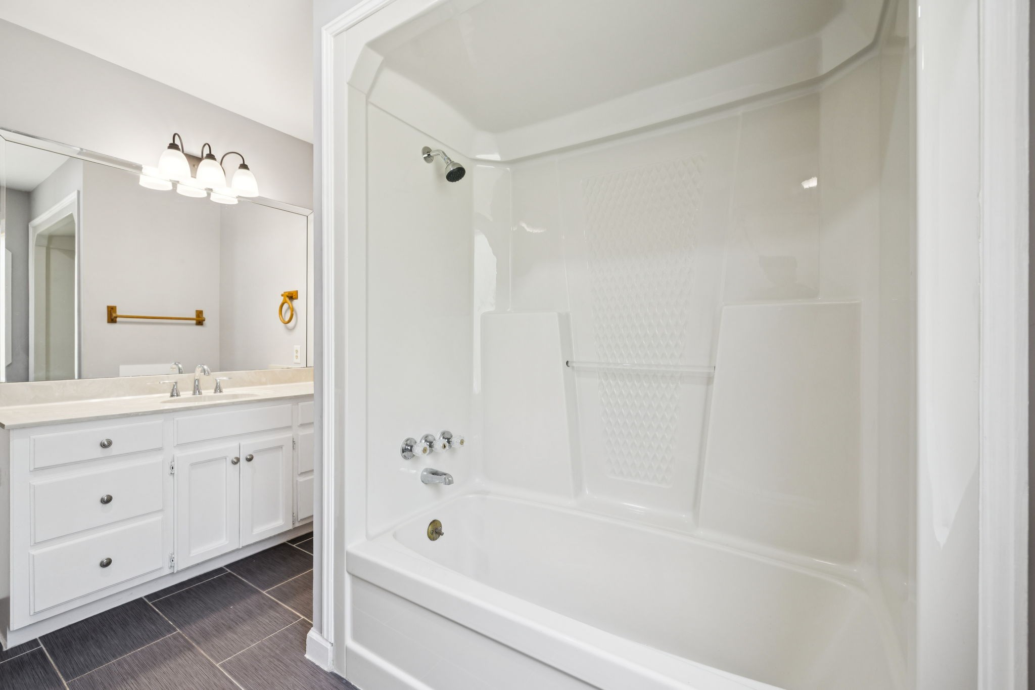 102 Warren Place Dickson, TN 37055 - Photo 36 of 52 a bathroom with a bathtub a sink and a mirror
