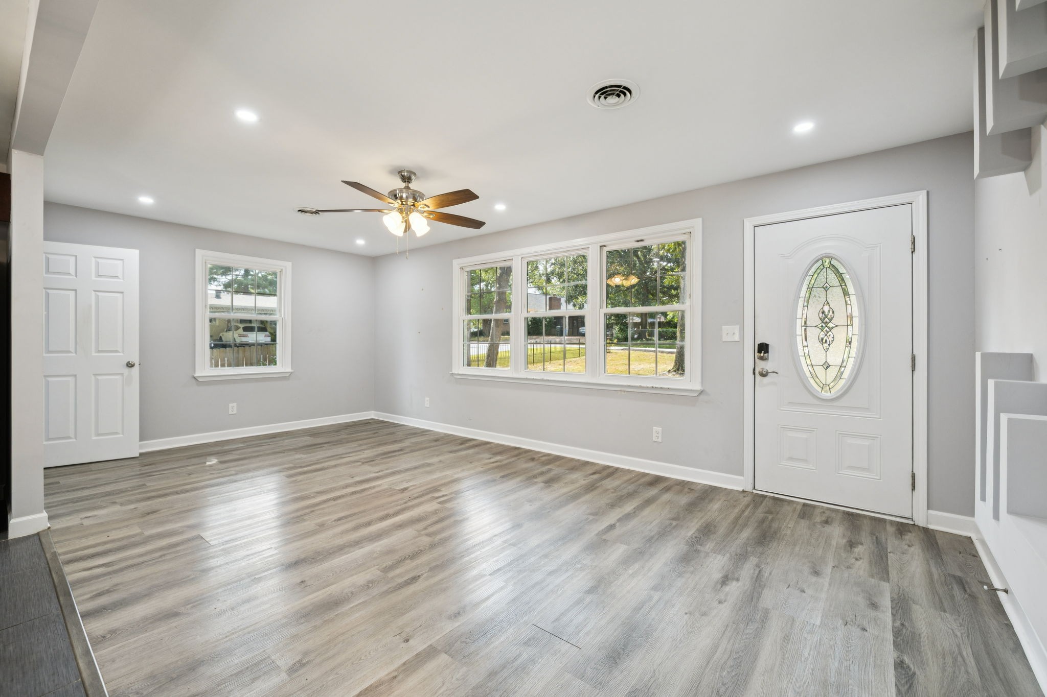 102 Warren Place Dickson, TN 37055 - Photo 6 of 52 an empty room with window and hardwood floor