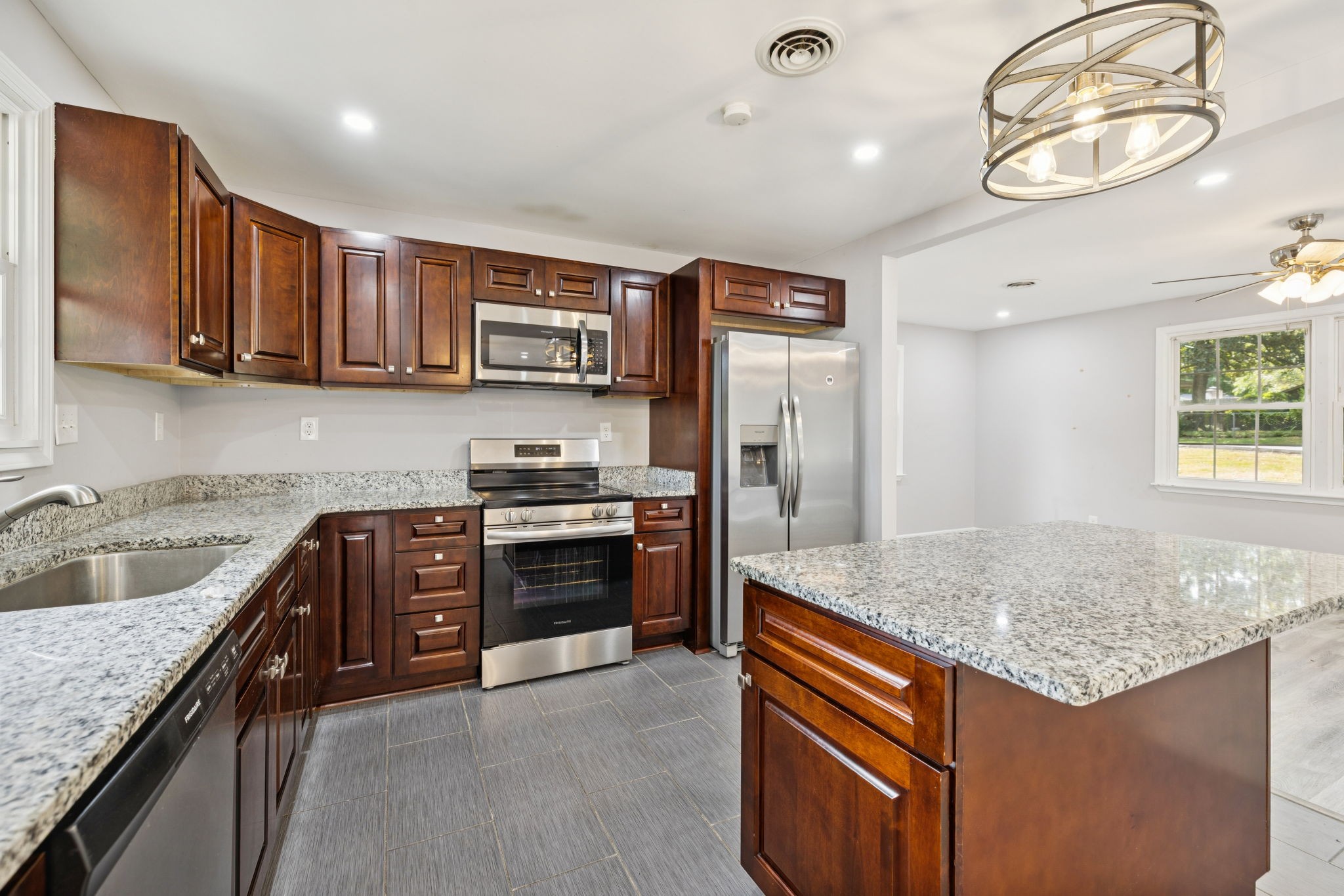 102 Warren Place Dickson, TN 37055 - Photo 8 of 52 a kitchen with stainless steel appliances granite countertop a sink stove and refrigerator