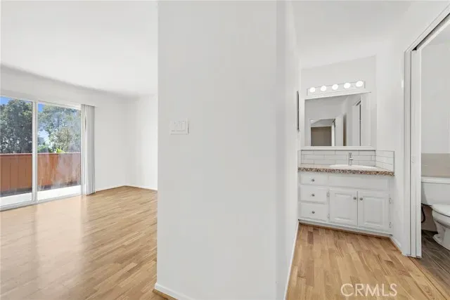 a backyard with wooden fence and some plants