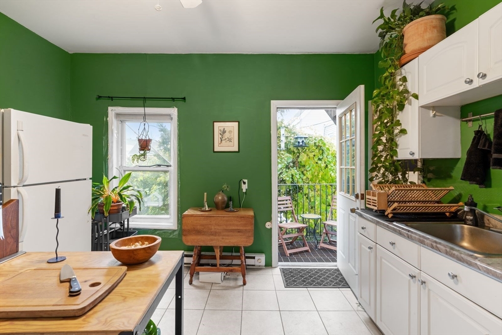 377 Dorchester Street, Unit 2 Boston, MA 02127 - Photo 11 of 18 a outdoor kitchen with green walls and sink