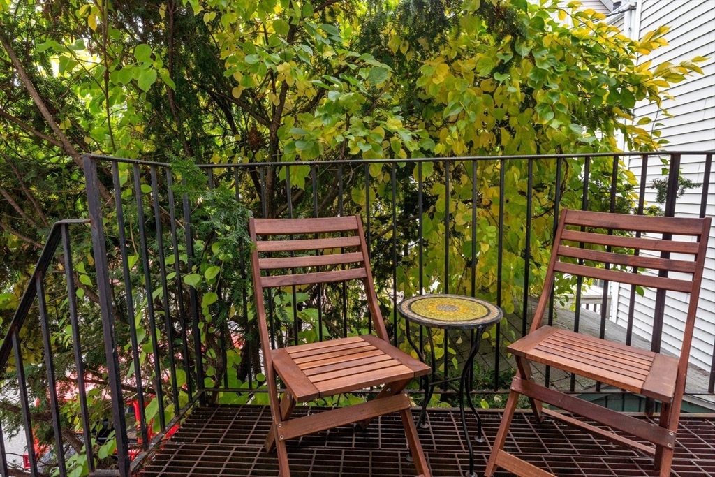 377 Dorchester Street, Unit 2 Boston, MA 02127 - Photo 12 of 18 a view of a chairs and table in a balcony