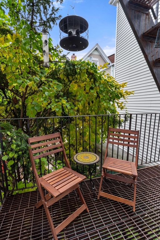 377 Dorchester Street, Unit 2 Boston, MA 02127 - Photo 14 of 18 a view of a chairs and table in the balcony