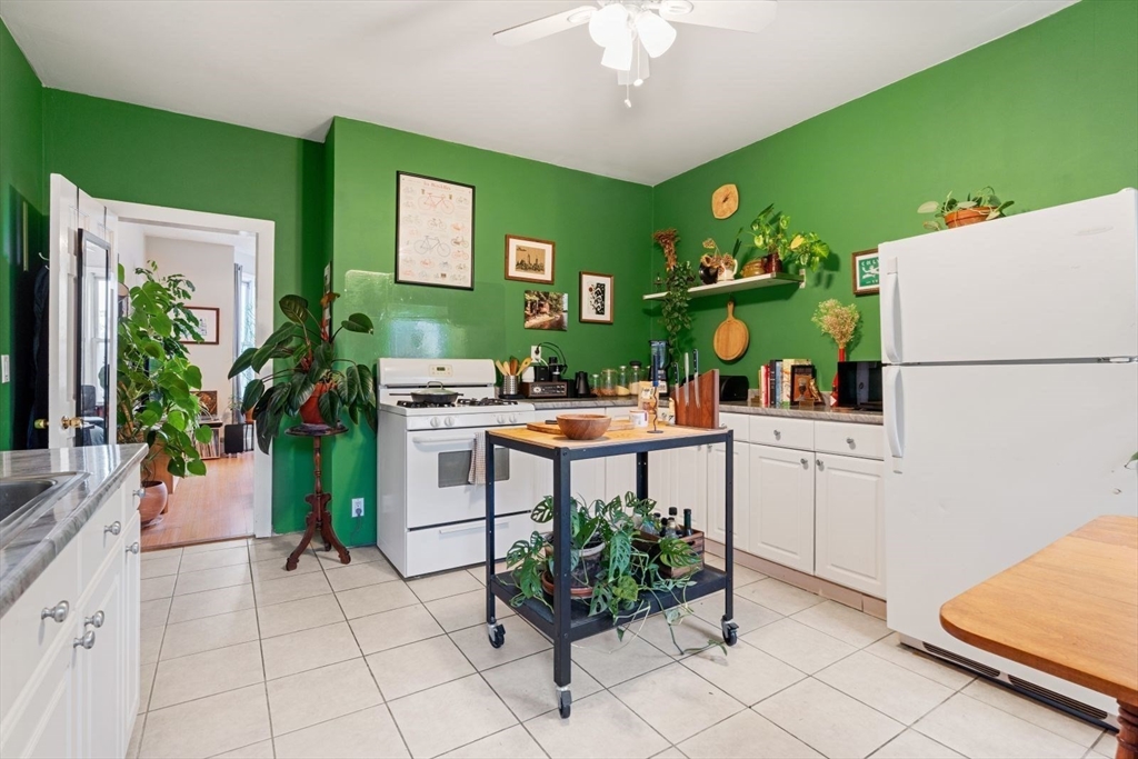 377 Dorchester Street, Unit 2 Boston, MA 02127 - Photo 6 of 18 a kitchen with a refrigerator and countertop