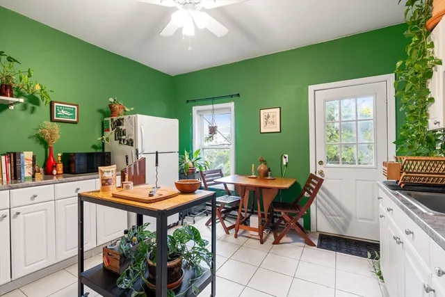 a outdoor kitchen with green walls and sink
