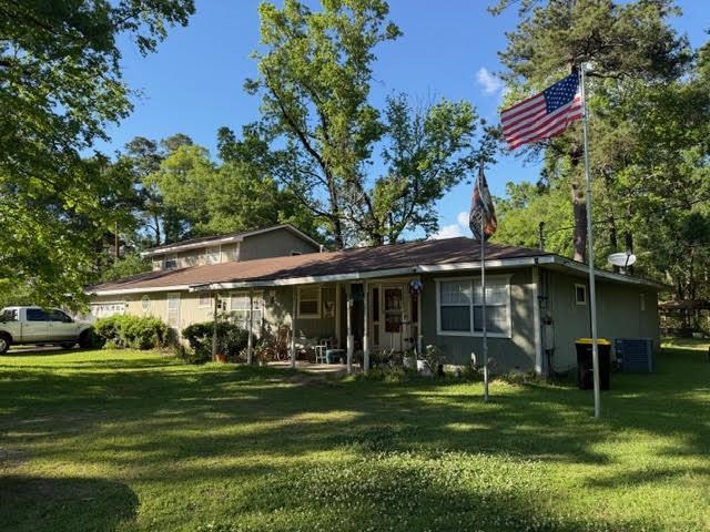 235 Connell Road Vidor, TX 77662 - Photo 2 of 35 a front view of a house with a garden