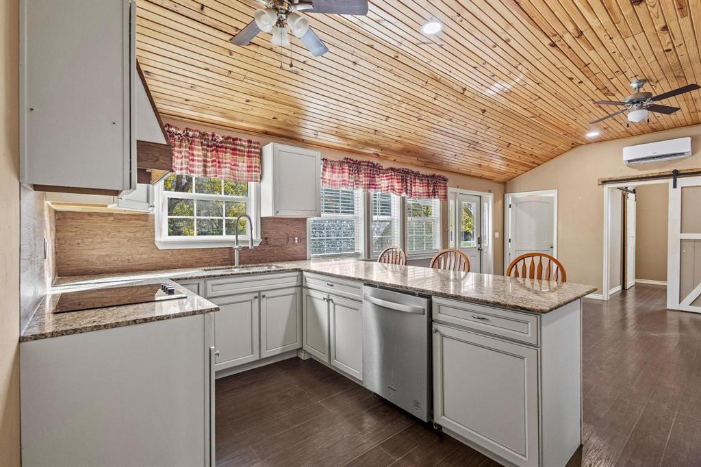 105 Reich Street Bonham, TX 75418 - Photo 11 of 31 a kitchen that has a sink and window