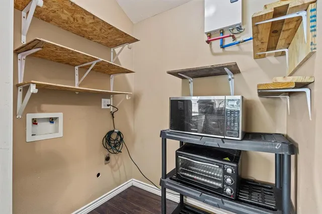 a room with gym equipment and a ceiling fan
