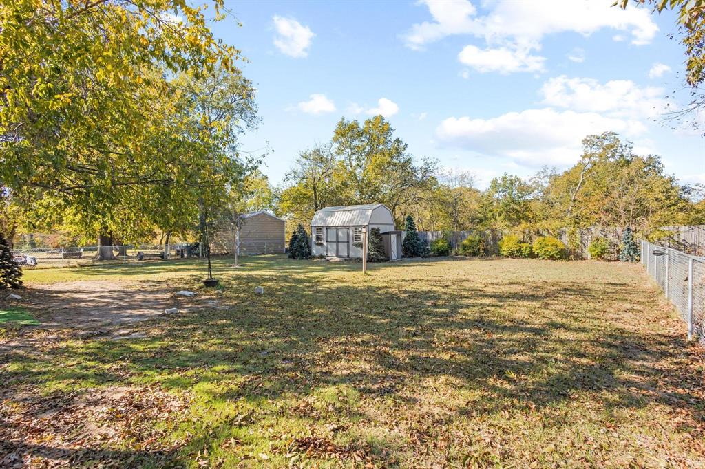 105 Reich Street Bonham, TX 75418 - Photo 26 of 31 a view of a field with large trees