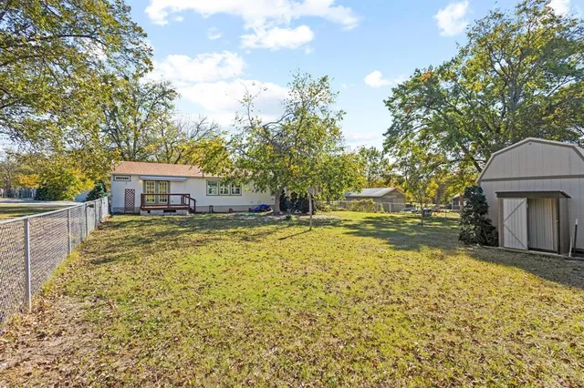 a house view with swimming pool in front of it
