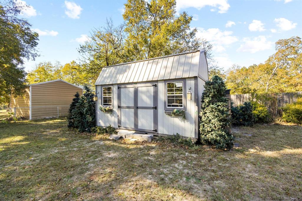 105 Reich Street Bonham, TX 75418 - Photo 28 of 31 a view of a house with a yard