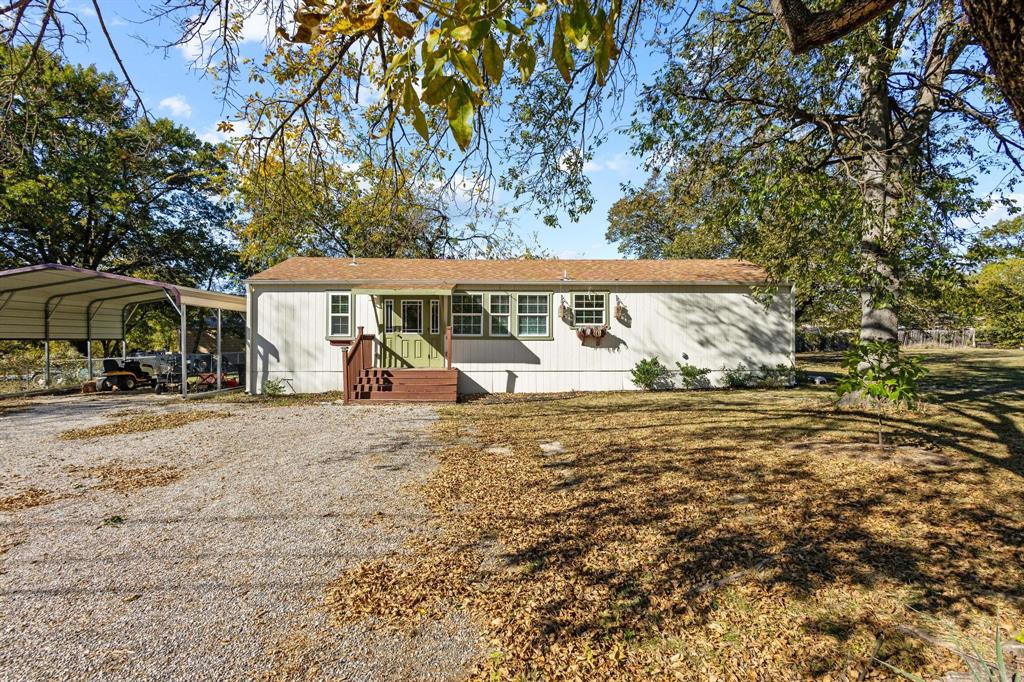 105 Reich Street Bonham, TX 75418 - Photo 4 of 31 a view of a house with a backyard