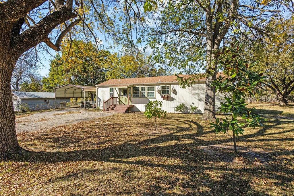 105 Reich Street Bonham, TX 75418 - Photo 5 of 31 a view of a house with a yard