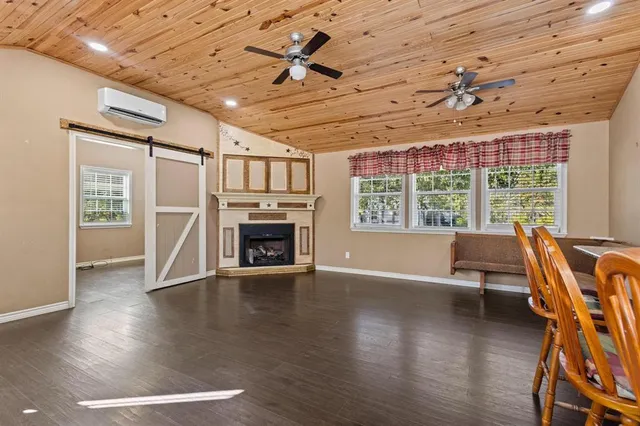 a view of livingroom with furniture window and wooden floor