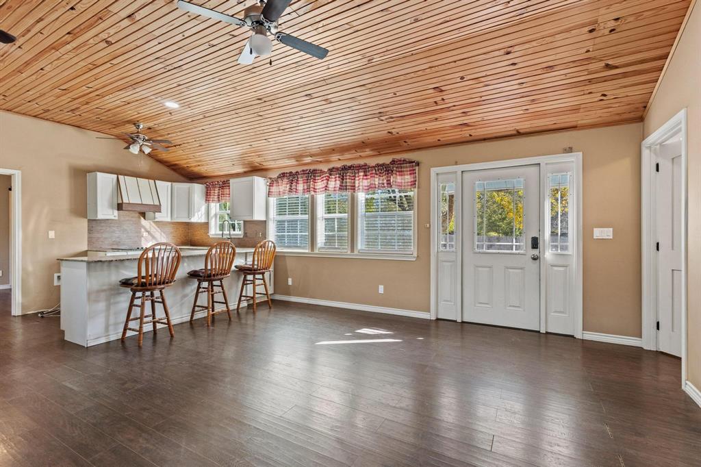 105 Reich Street Bonham, TX 75418 - Photo 8 of 31 a view of a dining room with furniture and wooden floor