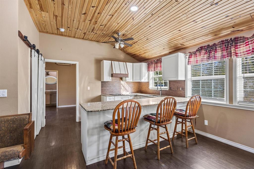 105 Reich Street Bonham, TX 75418 - Photo 9 of 31 a view of a dining room with furniture window and wooden floor