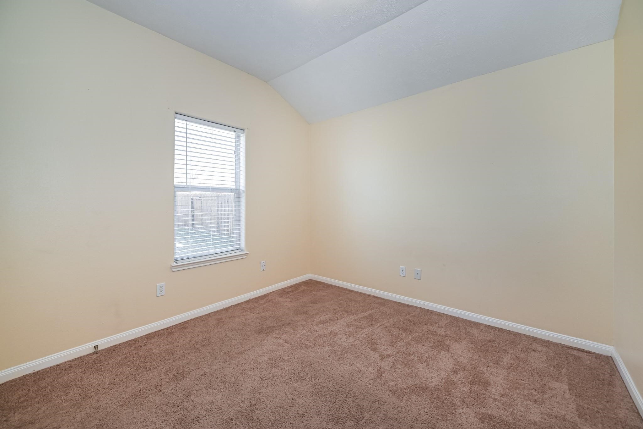 10002 Forest Spring Lane Pearland, TX 77584 - Photo 13 of 18 an empty room with a window