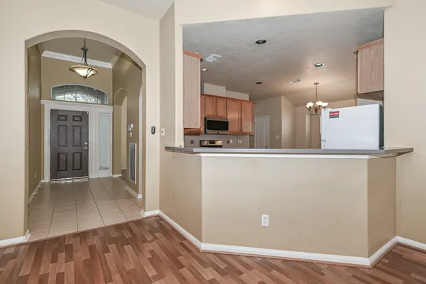 a view of kitchen with cabinets