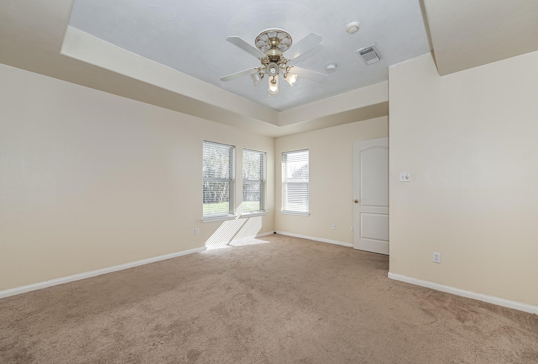 10002 Forest Spring Lane Pearland, TX 77584 - Photo 9 of 18 a view of an empty room with a window