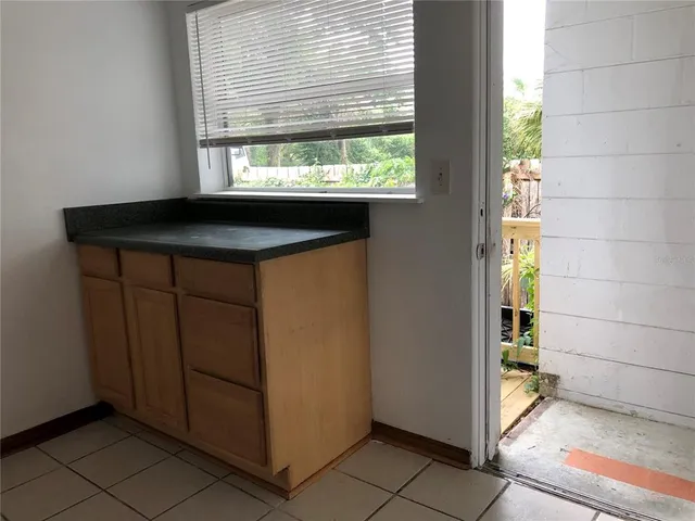 a kitchen with a sink and a window
