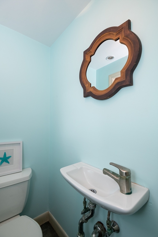 6 Island Park Road Ipswich, MA 01938 - Photo 18 of 41 a bathroom with a sink and mirror