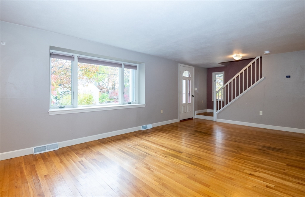 6 Island Park Road Ipswich, MA 01938 - Photo 22 of 41 a view of an empty room with wooden floor and a window